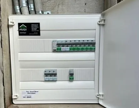New switchboard with labelled circuit breakers and RCDs, door open, fitted by Pivot Trade Services